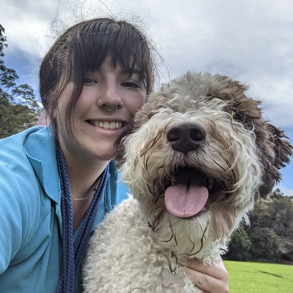 Jasmine, Pack Leader at Stellar Paws, with Milly during an off-leash dog walking session in Sydney